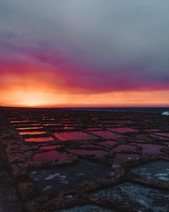 Malta travel guide Gozo island Ghajn Barrani salt pans right after sunset by Dancing the Earth