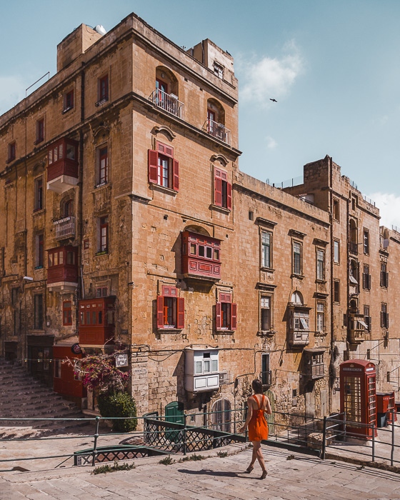 Malta travel guide Valletta red balconies by Dancing the Earth