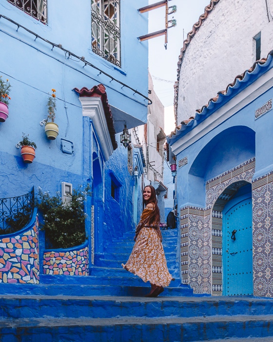 Morocco travel guide Chefchaouen blue stairs and tiled walls by Dancing the Earth