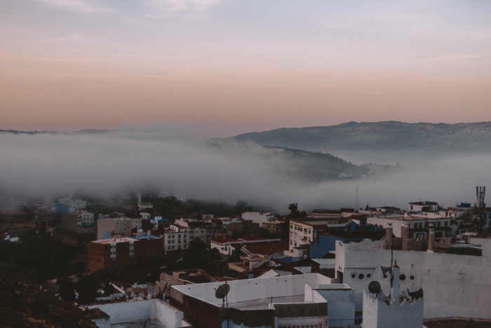 Morocco travel guide Chefchaouen inverted clouds at sunrise by Dancing the Earth