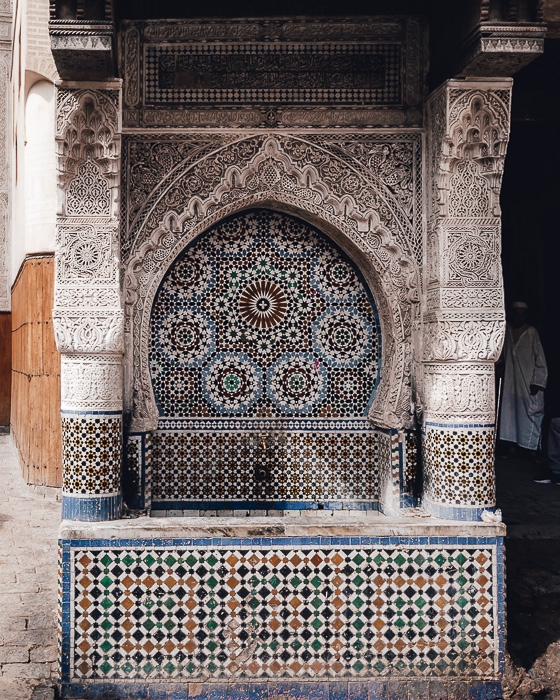 Morocco travel guide Fez tiled fountain by Dancing the Earth