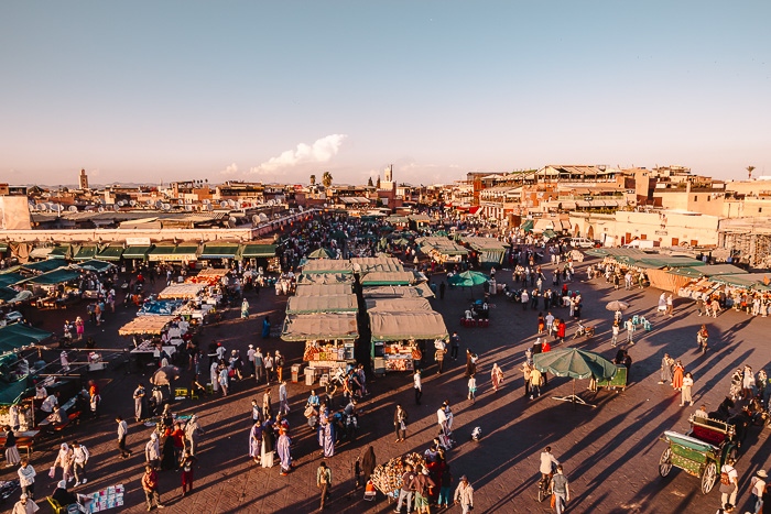 Morocco travel guide Place Jemaa el Fnaa in Marrakesh at sunset by Dancing the Earth