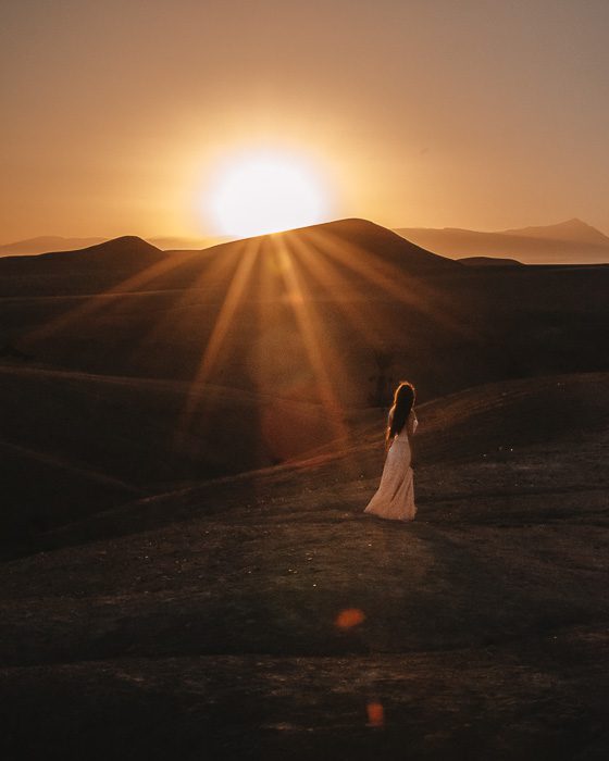 Morocco travel guide sun rising over the desert from Scarabeo Camp by Dancing the Earth