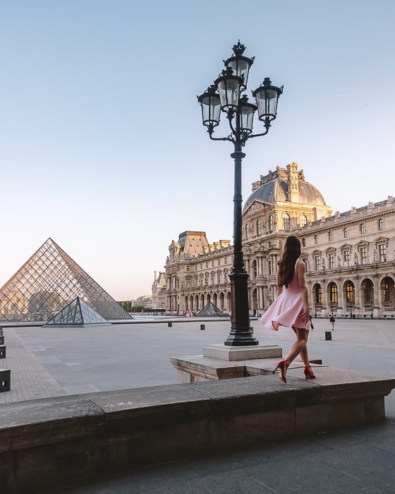 on the stairs behind Louvre pyramids by Dancing the Earth