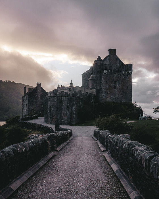 Scotland travel itinerary sunset at Eilean Donan Castle by Dancing the Earth