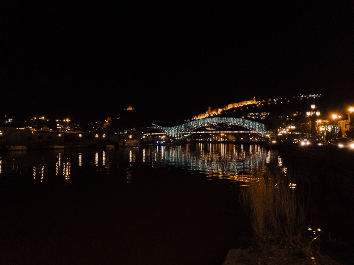 Tbilisi Peace Bridge from the distance by night by Dancing the Earth