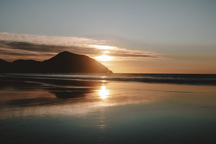 Sunset reflection in Wharariki Beach, Dancing the Earth