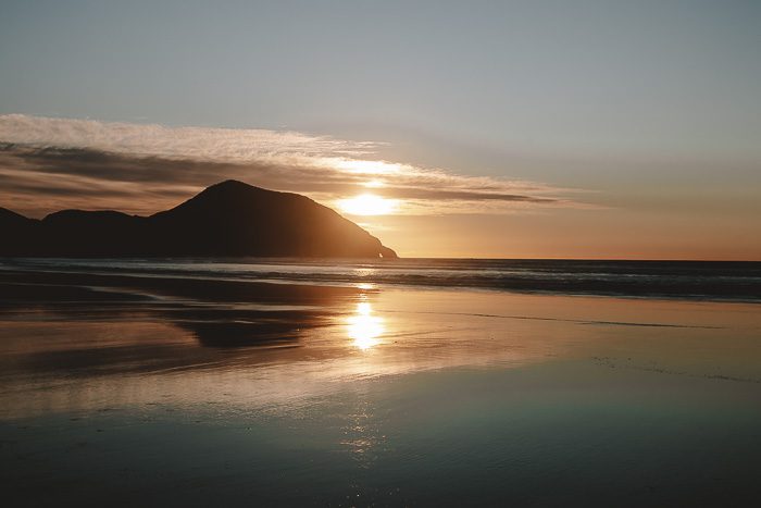 Sunset reflection in Wharariki Beach, Dancing the Earth