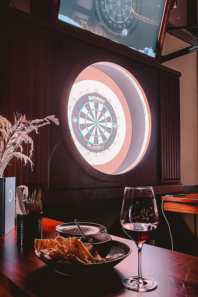 Playing darts at Oche Amsterdam, by Dancing The Earth