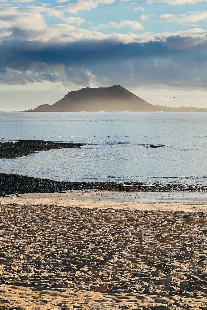 Fuerteventura travel guide, Golden hour on Lobos Island from Corralejo, by Dancing the Earth